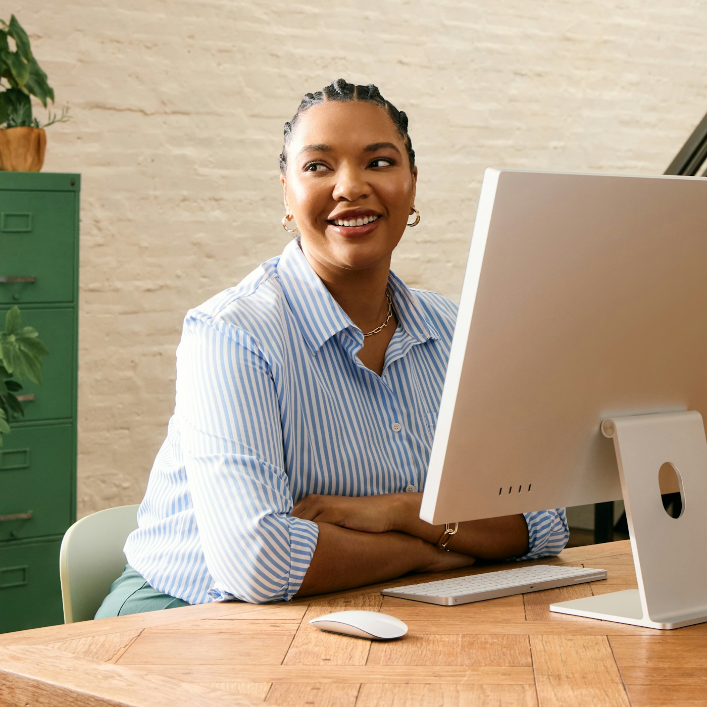 A friendly student smiling at a desk